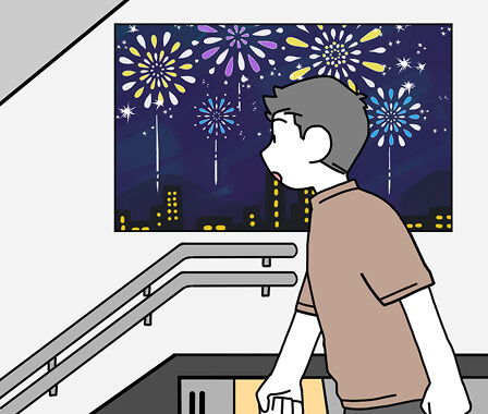 階段を降りようとしている男性と壁に花火のポスターが貼られている